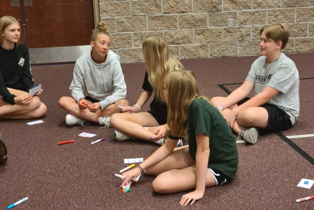 Youth Leadership Network kids doing teamwork activity. 